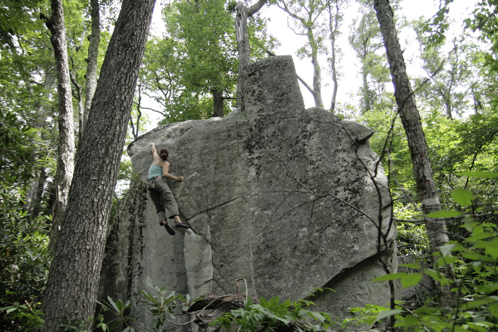 Leah Webb climbing West Texas (v2) on the Iceberg Boulder. Photo by TC Webb.